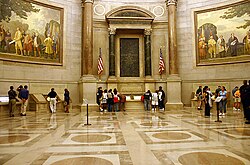 The National Archives' Rotunda for the Charters of Freedom where, between two Barry Faulkner murals, the original United States Declaration of Independence, United States Constitution, and other American founding documents are publicly exhibited