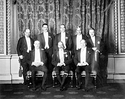 George V (Seated front) with British and Dominion prime ministers at the 1926 Imperial Conference. Standing (left to right): W.S. Monroe (Newfoundland), Gordon Coates (New Zealand), Stanley Bruce (Australia), J. B. M. Hertzog (Union of South Africa), W. T. Cosgrave (Irish Free State). Seated left: Stanley Baldwin (United Kingdom), seated right: William Mackenzie King (Canada)