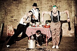A 2012 promotional image of the Red Hot Chili Peppers