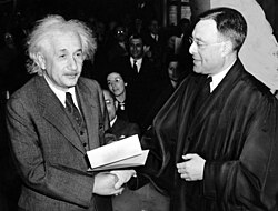 Einstein accepting a US citizenship certificate from judge Phillip Forman in 1940