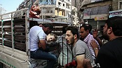 Wounded civilians getting rushed to a hospital in Aleppo