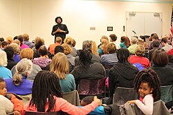 Author Jason Reynolds speaking at library event in Kalamazoo, Michigan