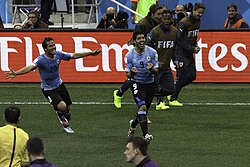 Suárez (middle) celebrating one of his two goals against England at the 2014 World Cup