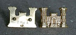 MacArthur was an engineer for the first 14 years of his military career. He received these golden castle pins as a gift upon graduation. He carried these pins with him for over 40 years and in 1945 gave them to Major General Leif J. Sverdrup, whom he thought more deserving to wear them. Sverdrup gave them to the Chief of Engineers in 1975. Every Chief of Engineers since then has worn MacArthur's pins.[27]