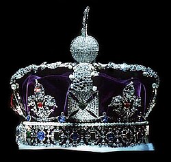 The British Imperial State Crown viewed from the side with the front facing left (the Black Prince's Ruby, and the Cullinan II are just visible in profile).