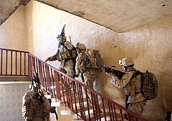 US Marines from 3rd Battalion 3rd Marines clear a house in Al Anbar Governorate.
