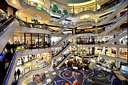 Consumers can buy a large range of goods and services at shopping malls.