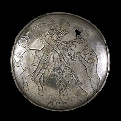 A Sasanian silver plate depicting a royal lion hunt