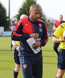Henry as coach of Arsenal under 19s in September 2015