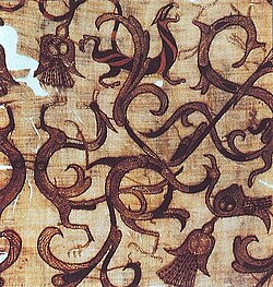 Detail of embroidered silk gauze ritual garment. Rows of even, round chain stitch used for outline and color. 4th century BC, Zhou tomb at Mashan, Hubei, China.