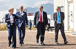 Secretary of Energy Jennifer Granholm (left) and President Joe Biden (second from left) visit a renewable energy laboratory in Colorado with Polis (second from right)