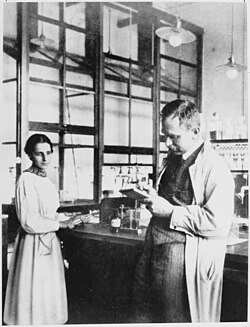 Meitner and Hahn in their laboratory, in 1913. When a colleague she did not recognise said that they had met before, Meitner replied: "You probably mistake me for Professor Hahn."[28]