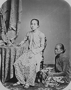 A Javanese noble lady (left) would address her servant with one vocabulary, and be answered with another. (Studio portrait of painter Raden Saleh's wife and a servant, colonial Batavia, 1860–1872.)