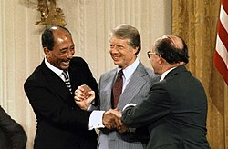 The Camp David Accords, ratified by Israel and Egypt in September 1978, were a vital step forward in improving ties between Jews and Arab Muslims by making a breakthrough towards a resolution of the Arab–Israeli conflict. From left to right: Egyptian president Anwar Sadat, American president Jimmy Carter, and Israeli prime minister Menachem Begin.