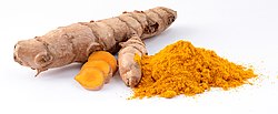 Turmeric rhizome, whole and ground into a spice