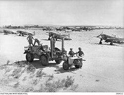 Australian soldiers in front of Morane-Saulnier MS.406s at Aleppo airfield in June 1941