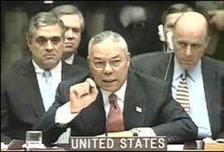 Colin Powell, the US Secretary of State, demonstrates a vial with alleged Iraq chemical weapon probes to the UN Security Council on Iraq war hearings, 5 February 2003.