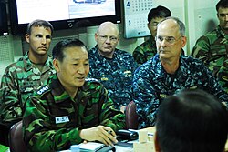 Vice Admiral Kim Jung-du, commander for the Republic of Korea Navy salvage efforts, and Rear Admiral Richard Landolt, on scene commander of U.S. support to South Korean salvage efforts, discuss salvage operations aboard the ROKS Dokdo