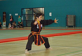 Sung Jin Suh, wearing a 8th Dahn Black Belt dobok.