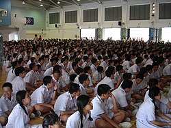 Students in the school hall of Nan Hua High School, a secondary school in Singapore