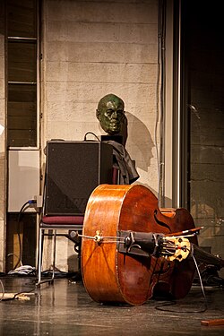 A mid-sized bass amp used to amplify a double bass at a small jazz gig