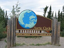 Sign indicating the point where the Dalton Highway crosses the Arctic Circle