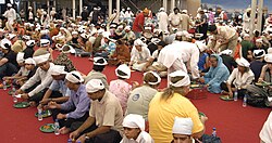 At the Sikh langar, all people eat a vegetarian meal as equals.