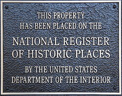 A typical black-and-bronze plaque found on properties listed in the NRHP, reading "This Property Has Been Placed on the National Register of Historic Places by the United States Department of the Interior".