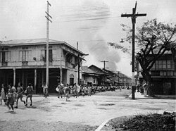 Citizens of Manila run for safety from suburbs burned by Japanese soldiers, 10 February 1945.