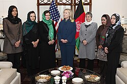 U.S. Secretary of State Hillary Clinton standing with Afghan female politicians, including Fauzia Koofi on her right and Sima Samar to her left.