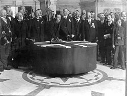 Edward Carson signing the Solemn League and Covenant in 1912, declaring opposition to Home Rule "using all means which may be found necessary"