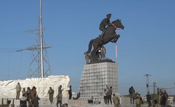 Syrian revolutionaries toppling a statue of Bassel al-Assad in New Aleppo, 30 November 2024