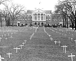Bascom Hill with crosses placed by students protesting the Vietnam War and sign reading, "Bascom Memorial Cemetery, Class of 1968"