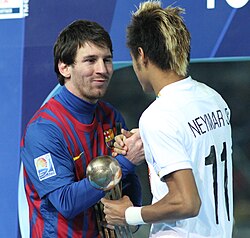 Messi accepting the Golden Ball award alongside future teammate Neymar after the 2011 FIFA Club World Cup final