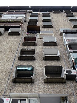 "TV buildings" named for the con­crete window frames that resemble TV screens (Belgrade, Serbia)