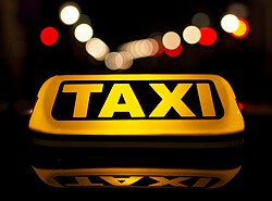 A luminous taxi top sign