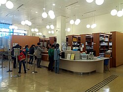 Library patrons checking out books, Tuen Mun Public Library in Hong Kong