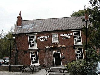 The Crooked House, a public house with a noticeable lean, the result of 19th-century mining subsidence in Staffordshire, England