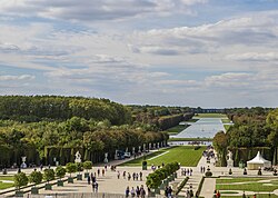 Image of a portion of the gardens of Versailles seen from in front of the palace's garden façade