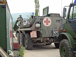 German Kosovo Force armoured medical transport, marked with the protective sign