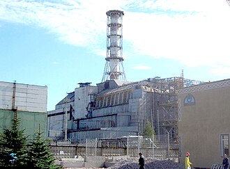 No.4 reactor site in 2006 showing the sarcophagus containment structure; reactor no.3 is to the left of the smoke stack