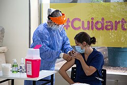 Health worker being vaccinated with Sputnik V against COVID-19 in Buenos Aires.