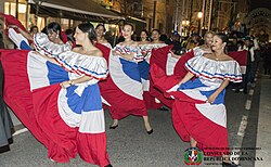Dominicans dancing in parade with traditional dress