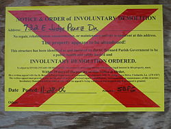 "Involuntary Demolition" notice, posted on buildings in St. Bernard Parish when there has been no significant effort to gut, secure, or repair the building over a year after Hurricane Katrina.