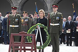 Irish President Mary McAleese with a wreath during the National Day of Commemoration ceremony. The national day occurs in July and commemorates all Irish people who died in conflicts.