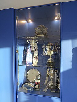 Trophy cabinet with the Carling Cup trophy