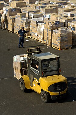 Forklift carrying boxes of humanitarian aid
