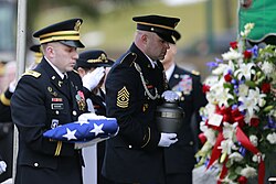 A soldier presents Schwarzkopf's cremated remains at his memorial service on 28 February 2013