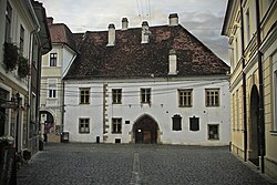 Matthias Corvinus Alley, facing the birthplace of the eponymous King of Hungary