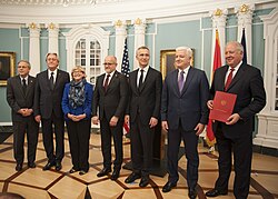 Montenegro Foreign Minister Srdjan Darmanović presents a document to US Undersecretary of State for Political Affairs Thomas Shannon and Montenegro Prime Minister Duško Marković during a ceremony at the State Department to accept Montenegro's instrument of accession to the North Atlantic Treaty Organization (NATO), 5 June 2017.